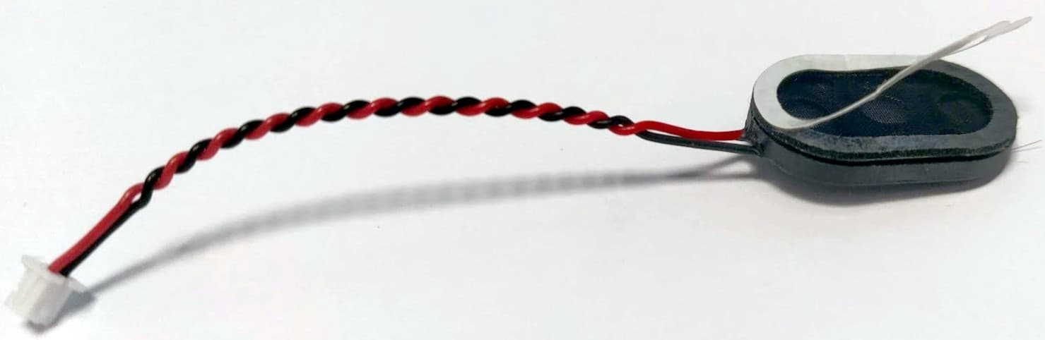 Speaker with adhesive edge and connector